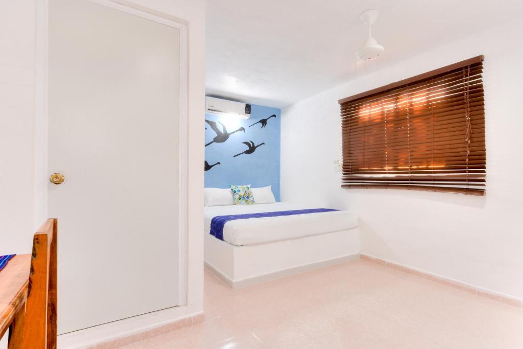 Postel nebo postele na pokoji v ubytování HOTEL LAS COLORADAS