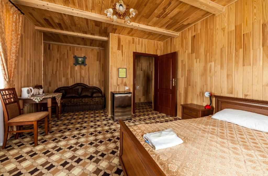 Postel nebo postele na pokoji v ubytování Olga Hotel SPA