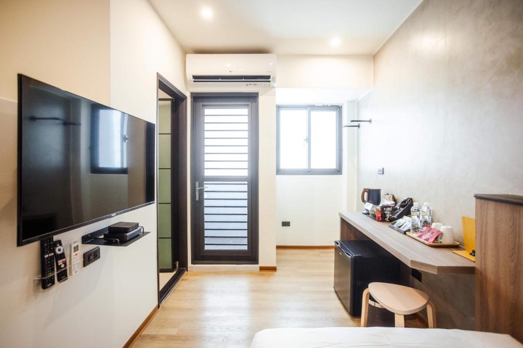 TV a/nebo společenská místnost v ubytování kaori B&B