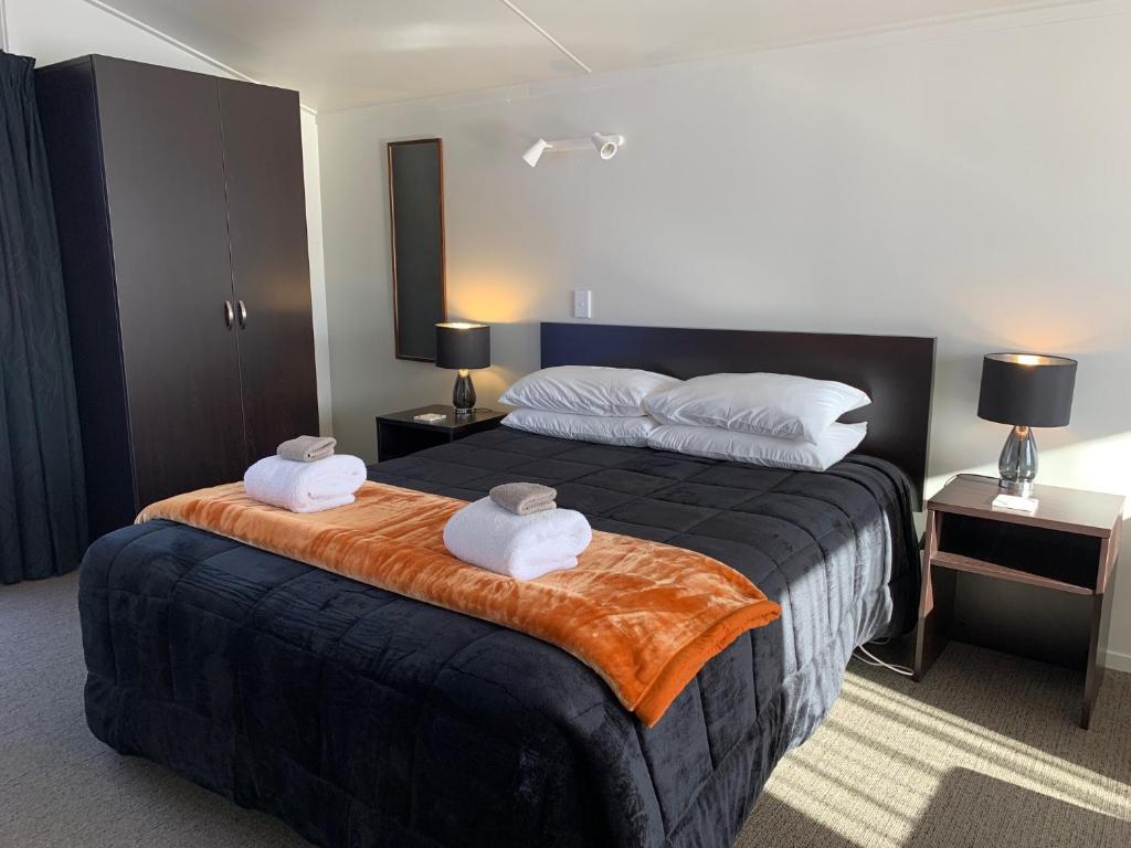Postel nebo postele na pokoji v ubytování Anderson Park Motel