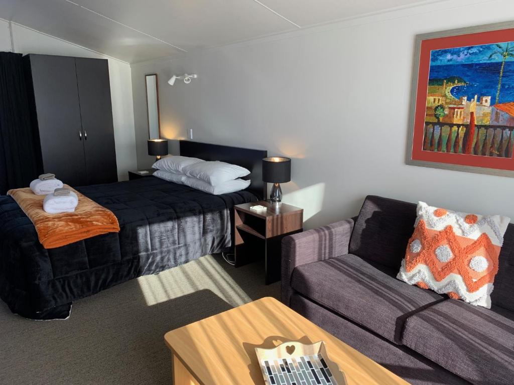 Postel nebo postele na pokoji v ubytování Anderson Park Motel