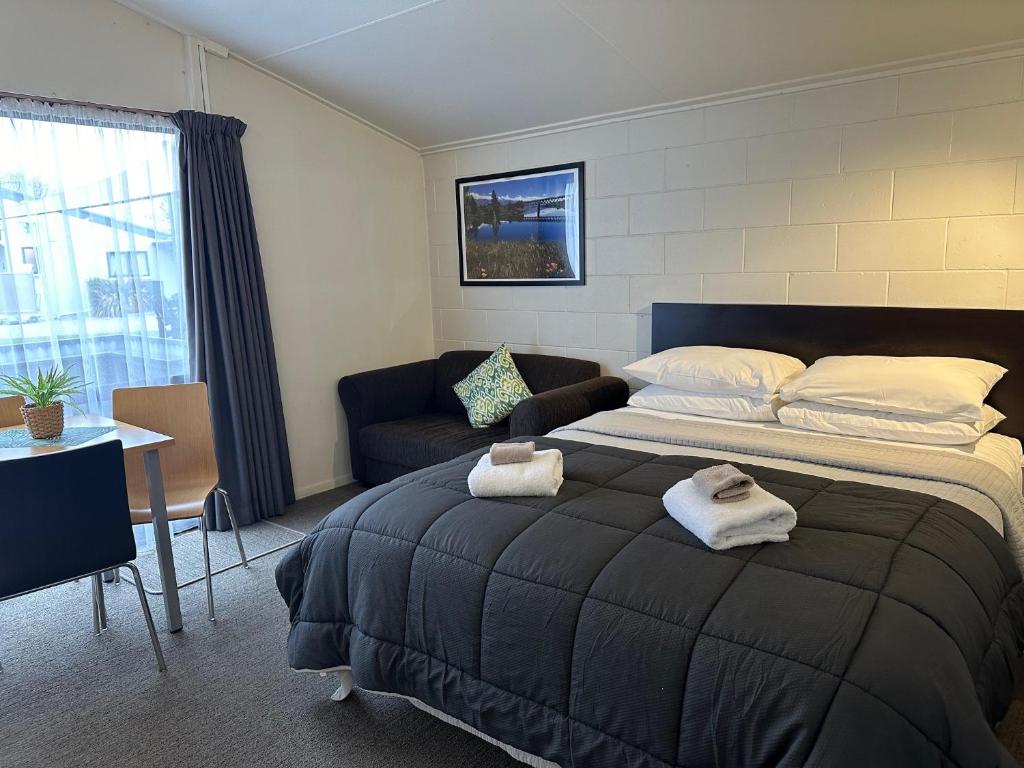 Postel nebo postele na pokoji v ubytování Anderson Park Motel