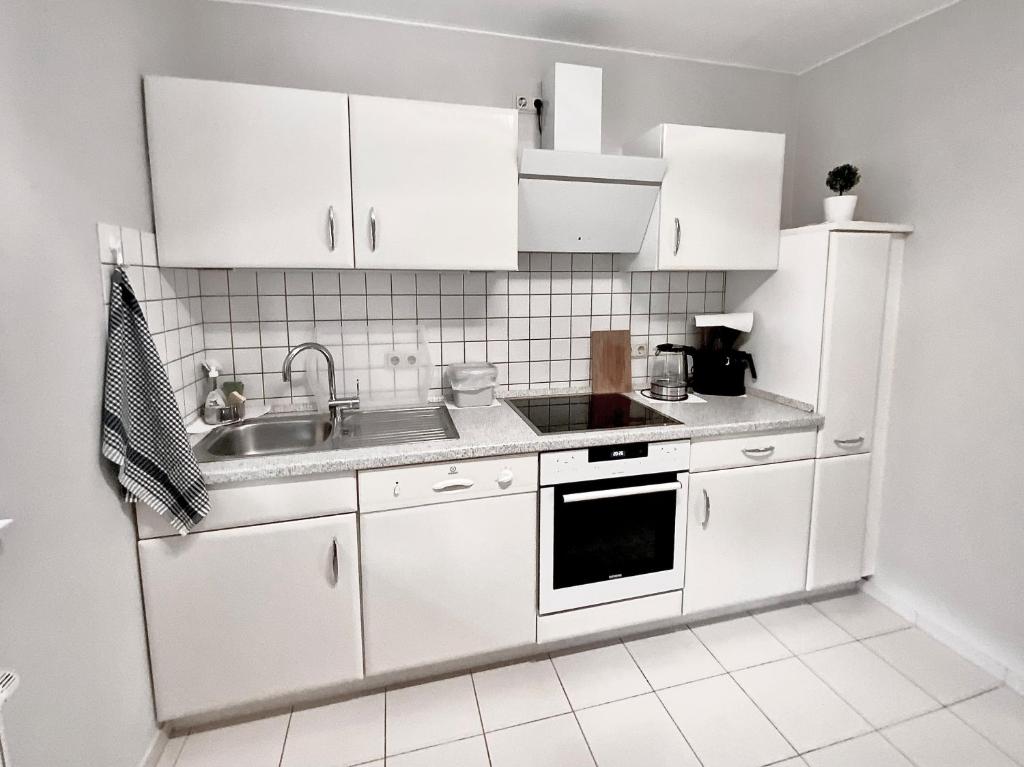 Kuchyň nebo kuchyňský kout v ubytování Gästehaus Backes