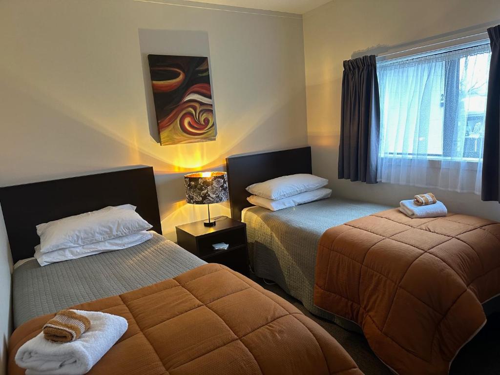 Postel nebo postele na pokoji v ubytování Anderson Park Motel