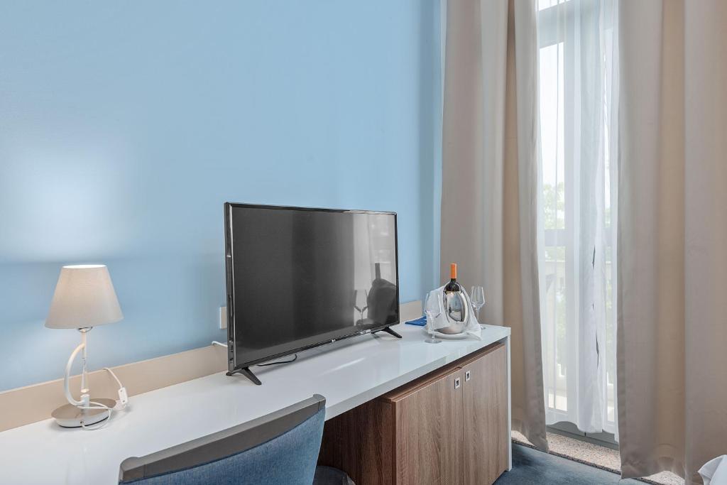 TV a/nebo společenská místnost v ubytování Boutique Hotel Mali Raj