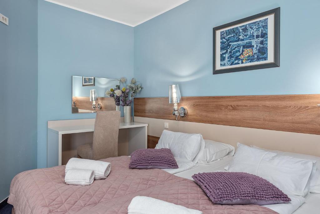 Postel nebo postele na pokoji v ubytování Boutique Hotel Mali Raj