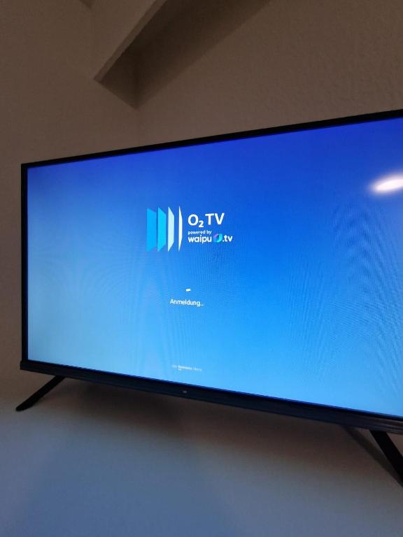 TV a/nebo společenská místnost v ubytování Doppelzimmer-Bad-Kühlschrank-Tv-19
