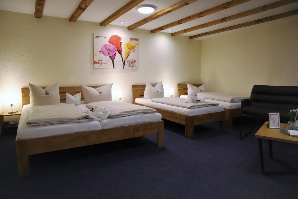 Postel nebo postele na pokoji v ubytování Hotel zur Isar
