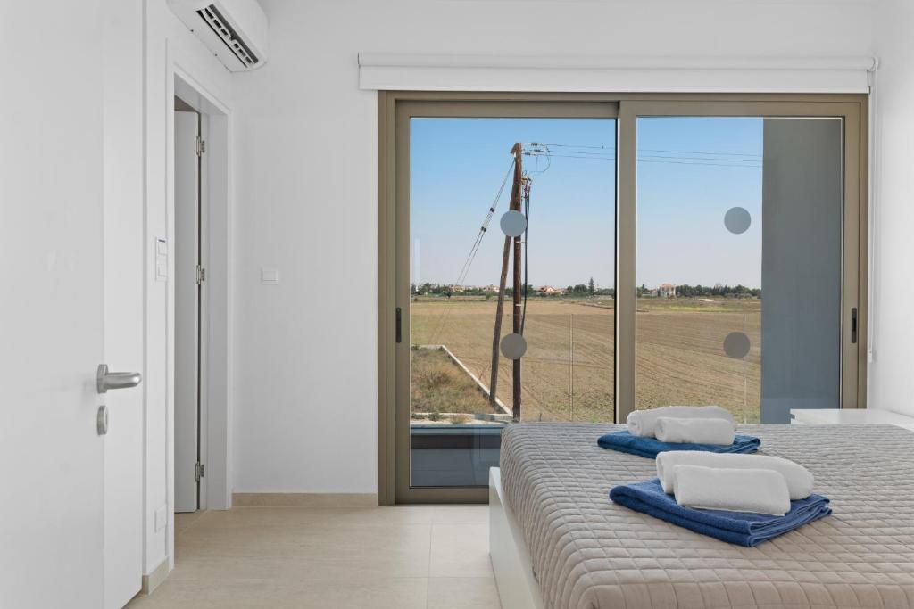 Postel nebo postele na pokoji v ubytování Serenity Waves Villa 26
