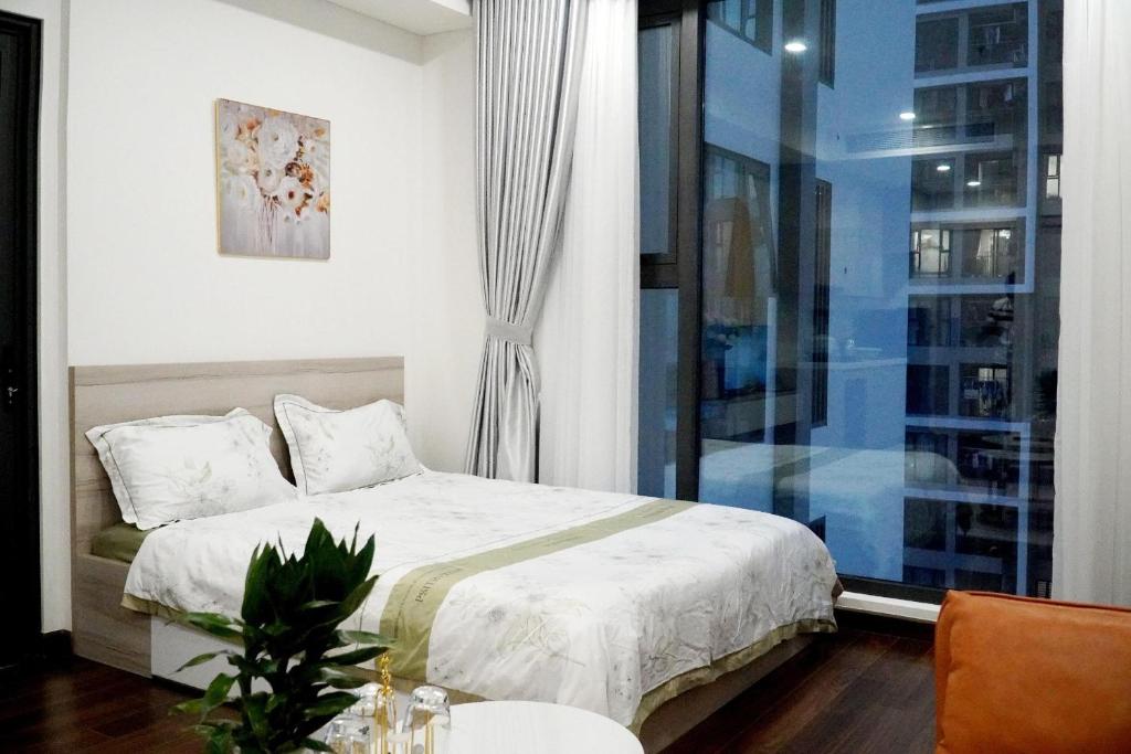 Ένα ή περισσότερα κρεβάτια σε δωμάτιο στο Vinhome Smart CiTy toà D