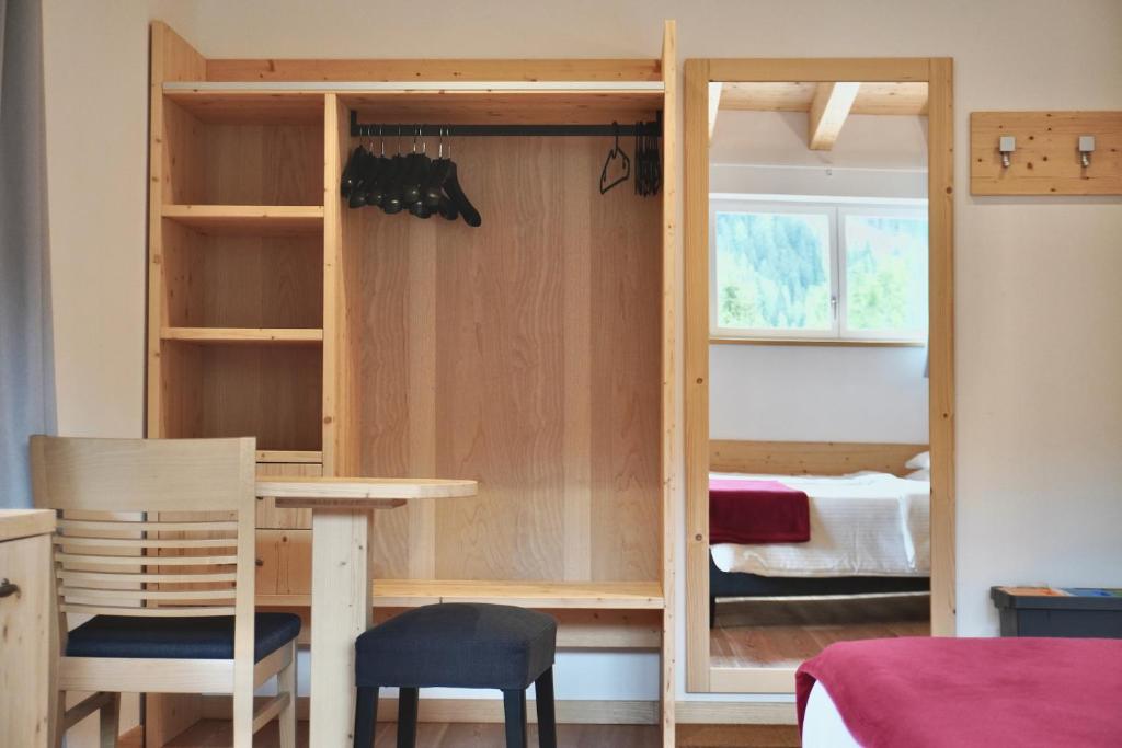 Postel nebo postele na pokoji v ubytování Hotel Garni Civetta