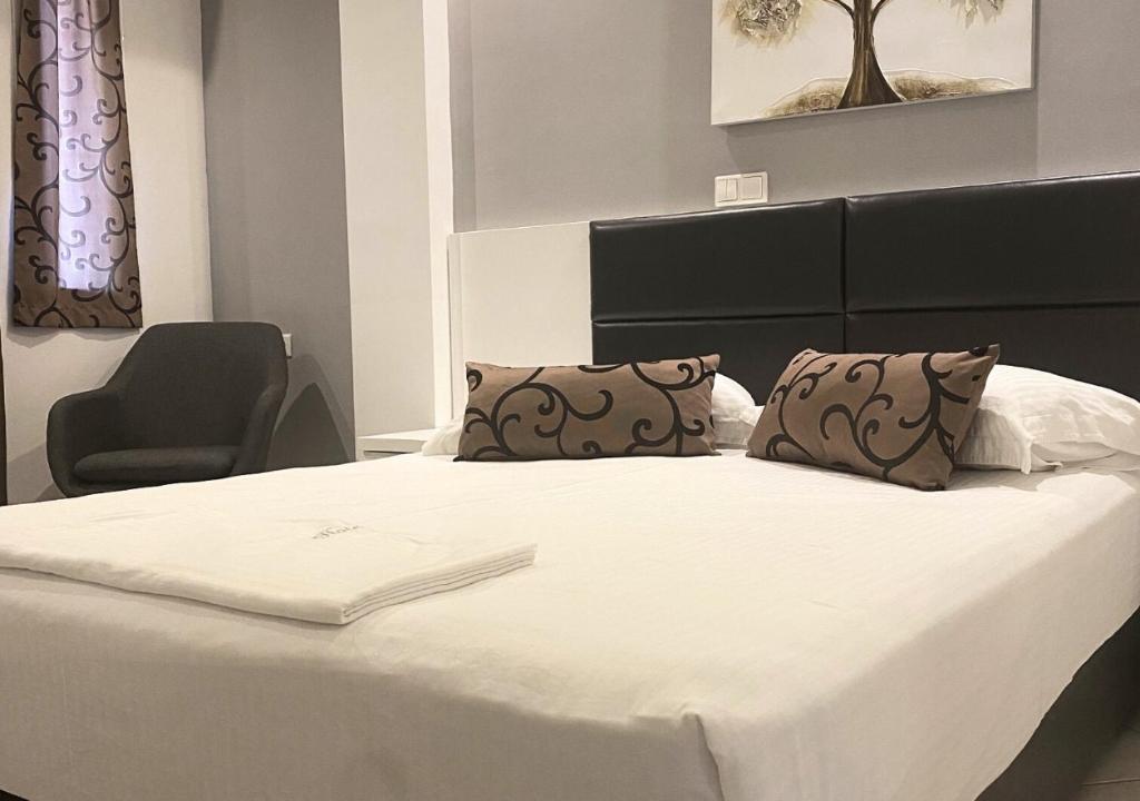 Postel nebo postele na pokoji v ubytování Zeus Hotel