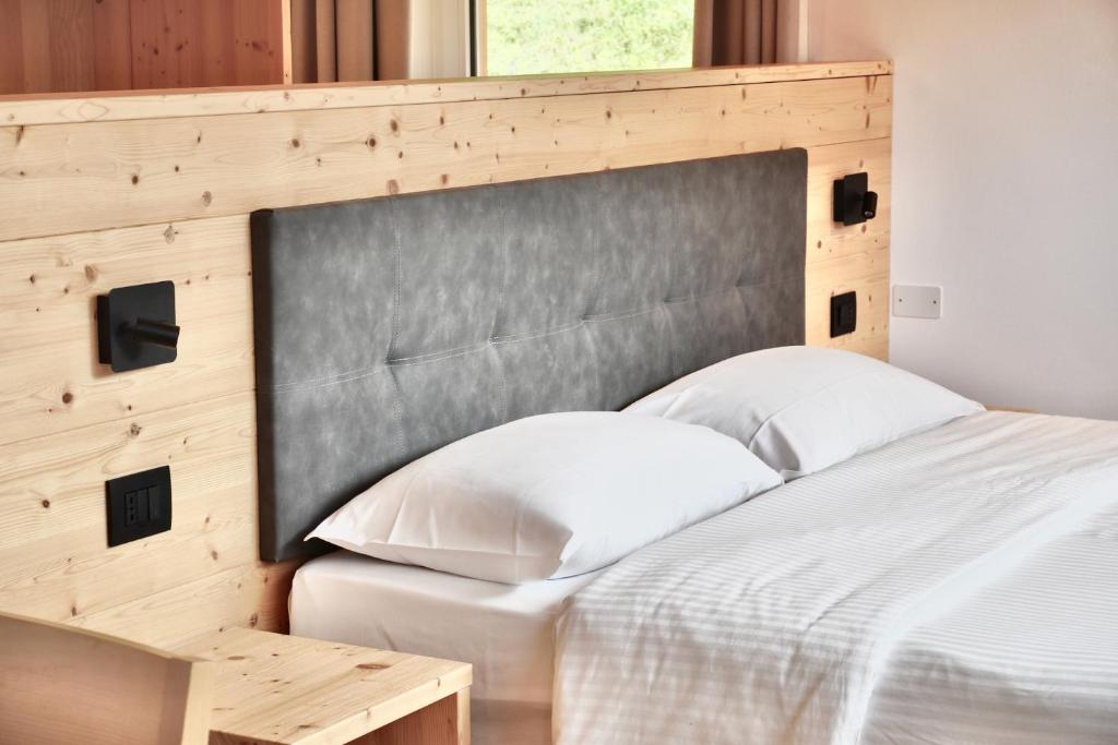 Postel nebo postele na pokoji v ubytování Hotel Garni Civetta