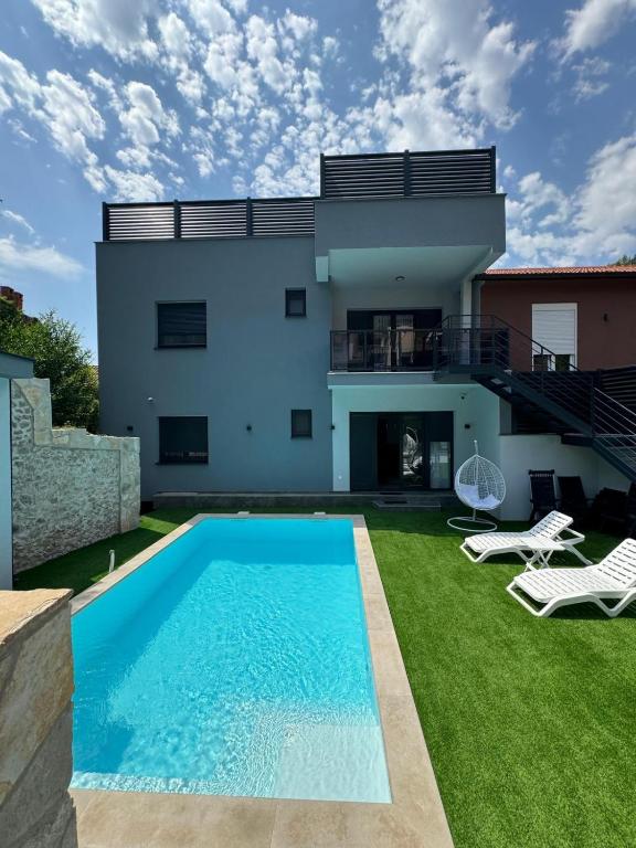 a villa with a swimming pool and a house at Herzegovina Dream Residence in Stolac