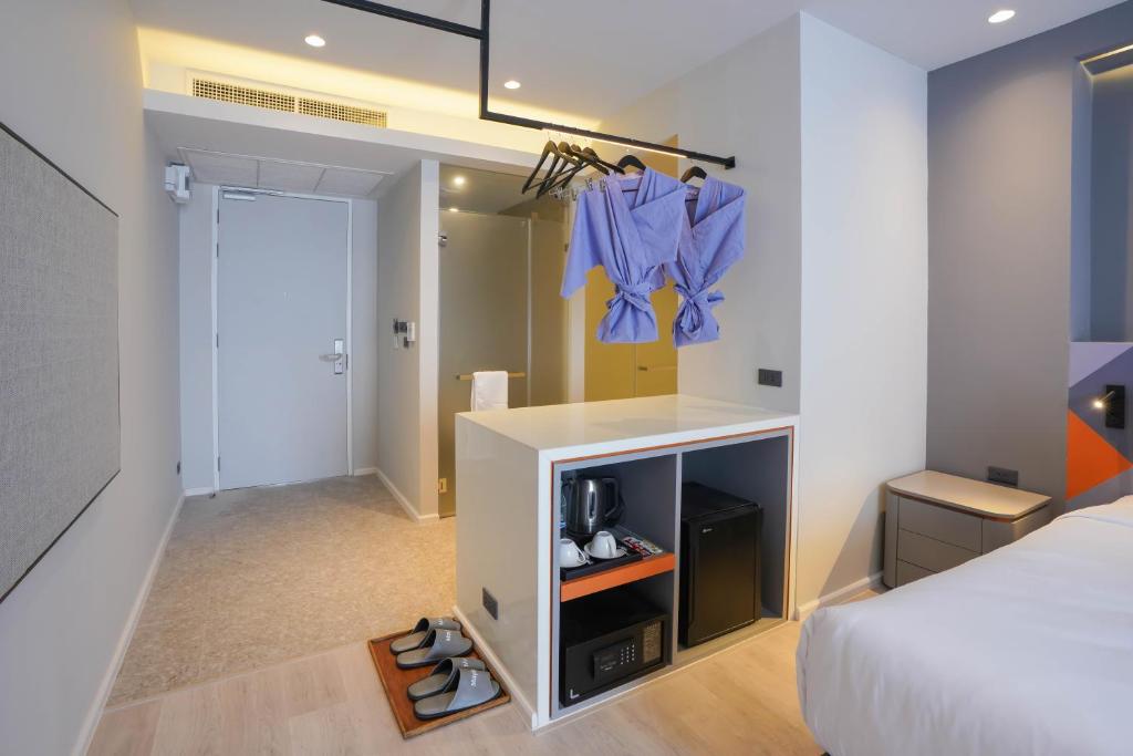 Postel nebo postele na pokoji v ubytování Maybis Hotel