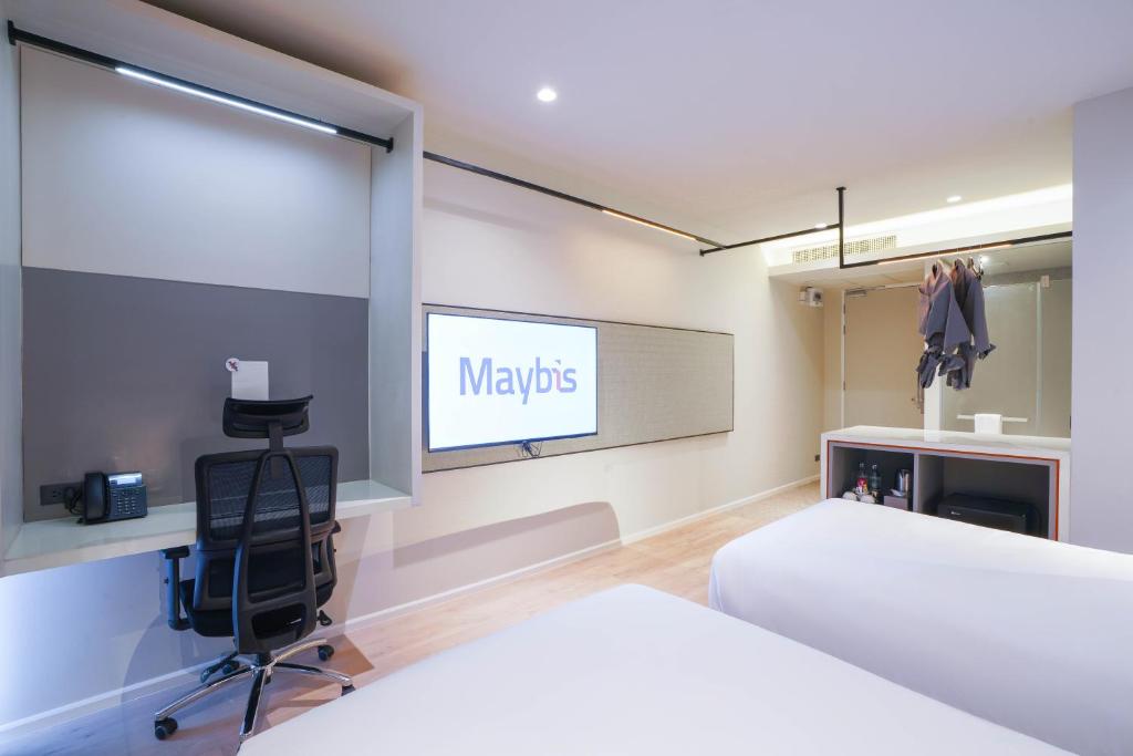 Postel nebo postele na pokoji v ubytování Maybis Hotel