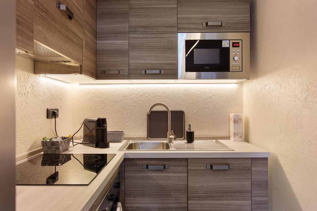 Kuchyň nebo kuchyňský kout v ubytování Casa Piertor Morgex