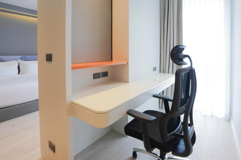 Postel nebo postele na pokoji v ubytování Maybis Hotel