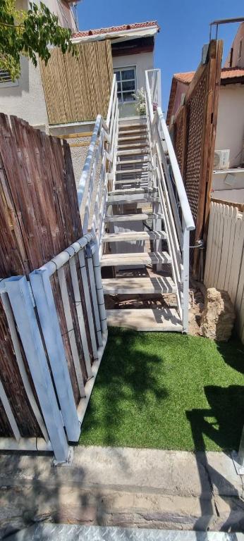 a set of stairs leading up to a house at Suits יחידת נופש מתוקה באילת in Eilat