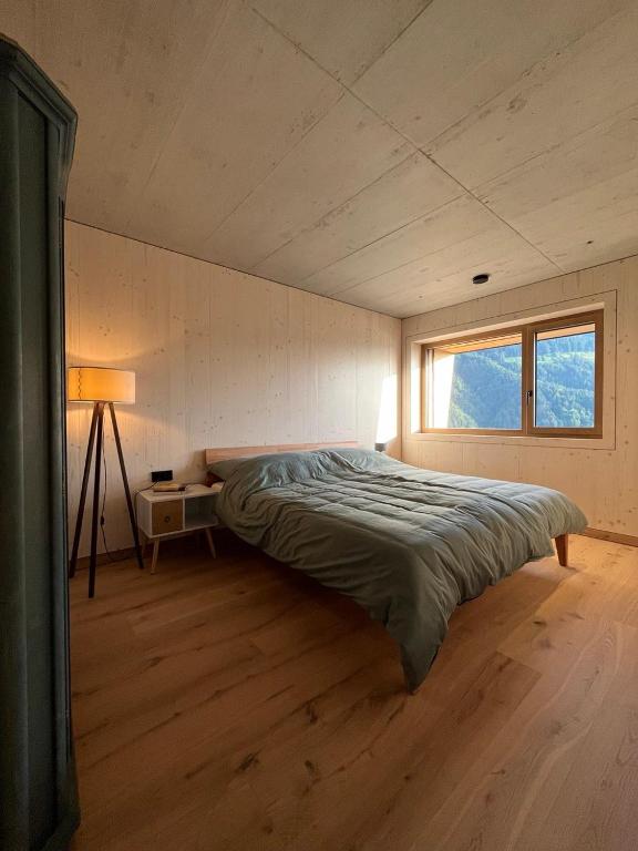Postel nebo postele na pokoji v ubytování Walsergrat Appartements