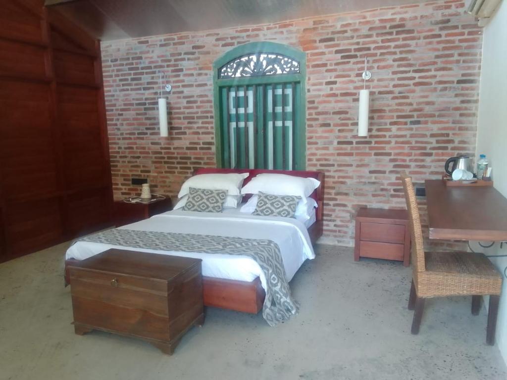 Postel nebo postele na pokoji v ubytování Club Mango Resort