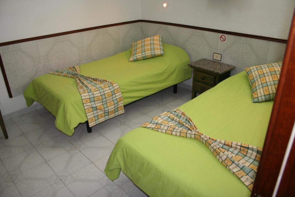 A bed or beds in a room at Apartamentos Maba Playa