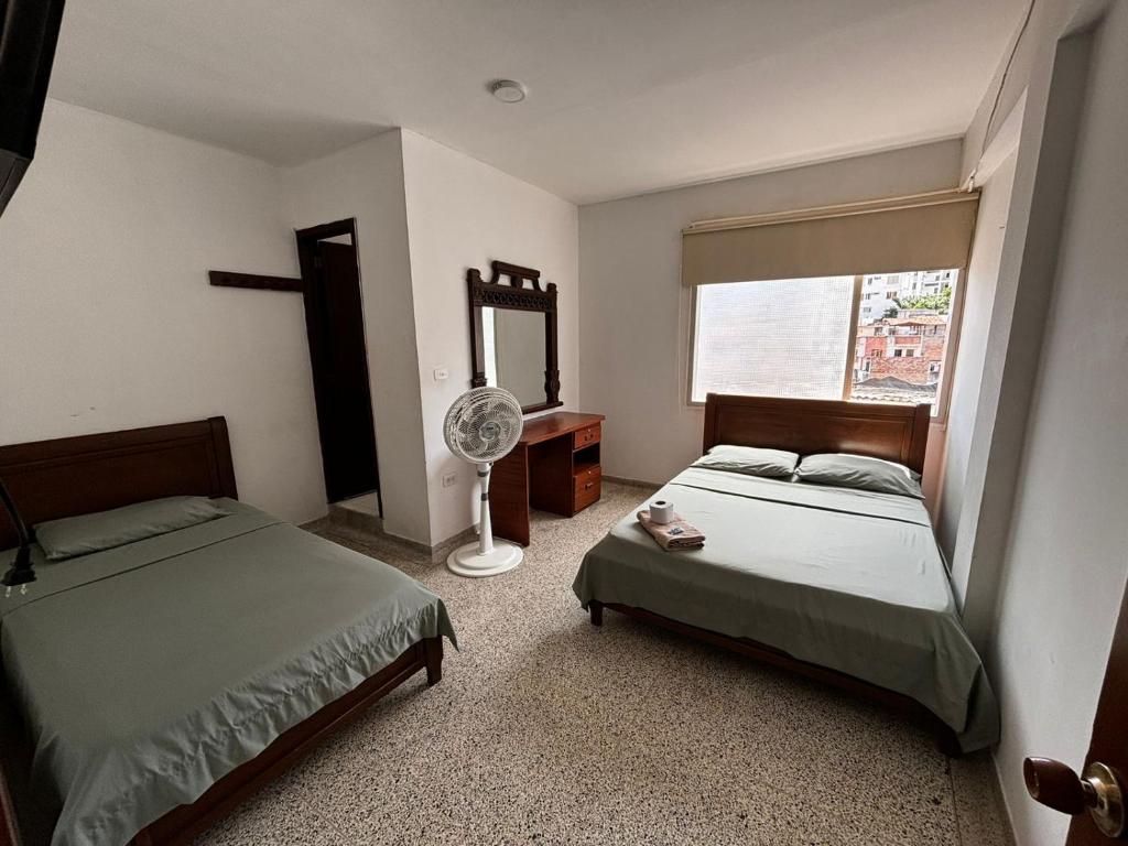 Postel nebo postele na pokoji v ubytování Hotel el Recuerdo