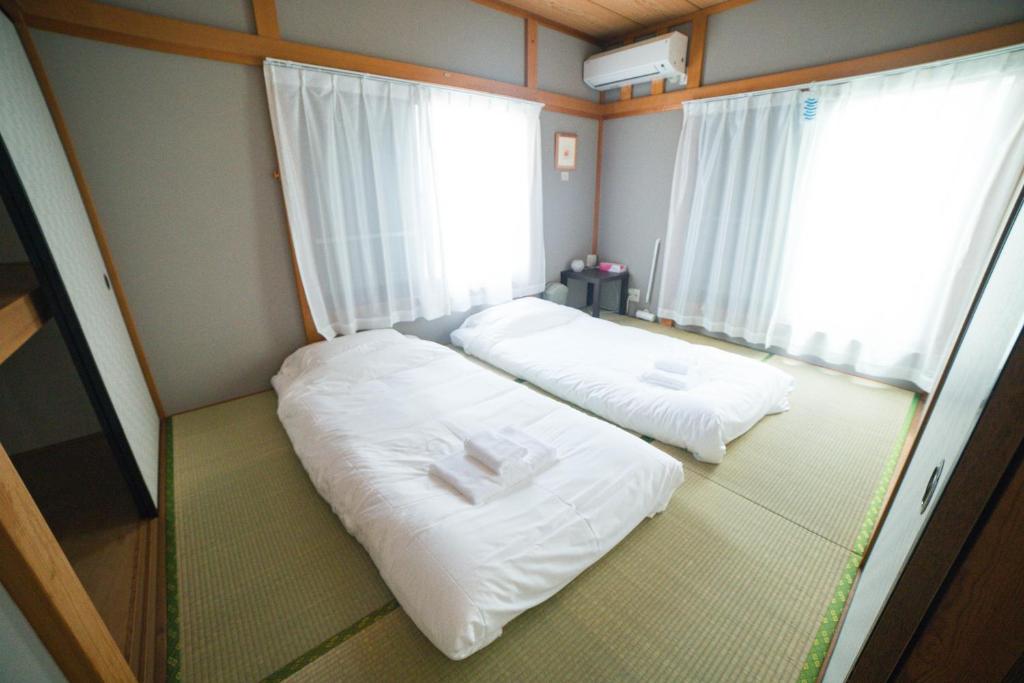 Postel nebo postele na pokoji v ubytování Blessing Guest House