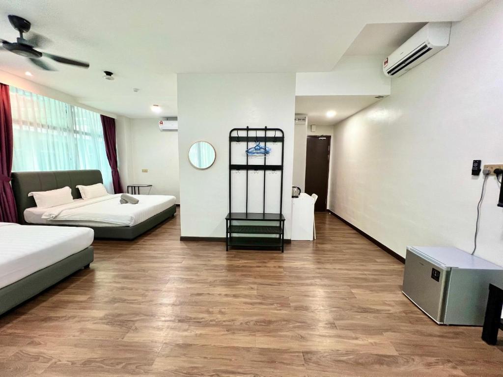 Postel nebo postele na pokoji v ubytování Margo Hotel Kota Kinabalu