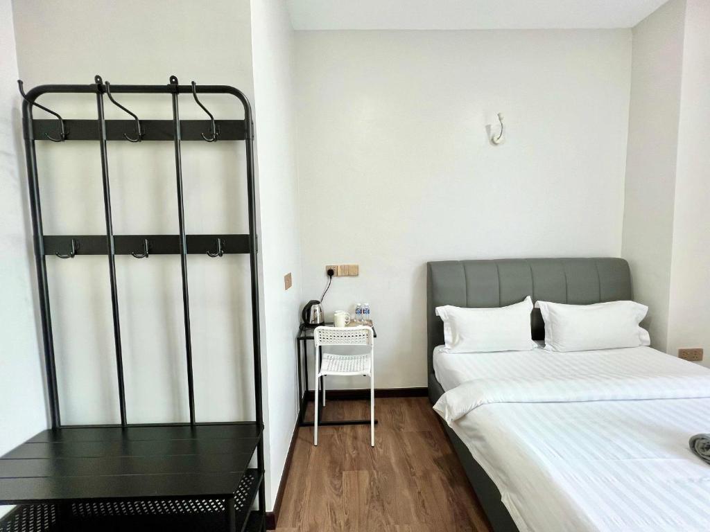 Postel nebo postele na pokoji v ubytování Margo Hotel Kota Kinabalu