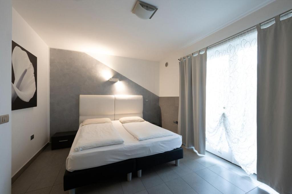 Een bed of bedden in een kamer bij Residence Desiree