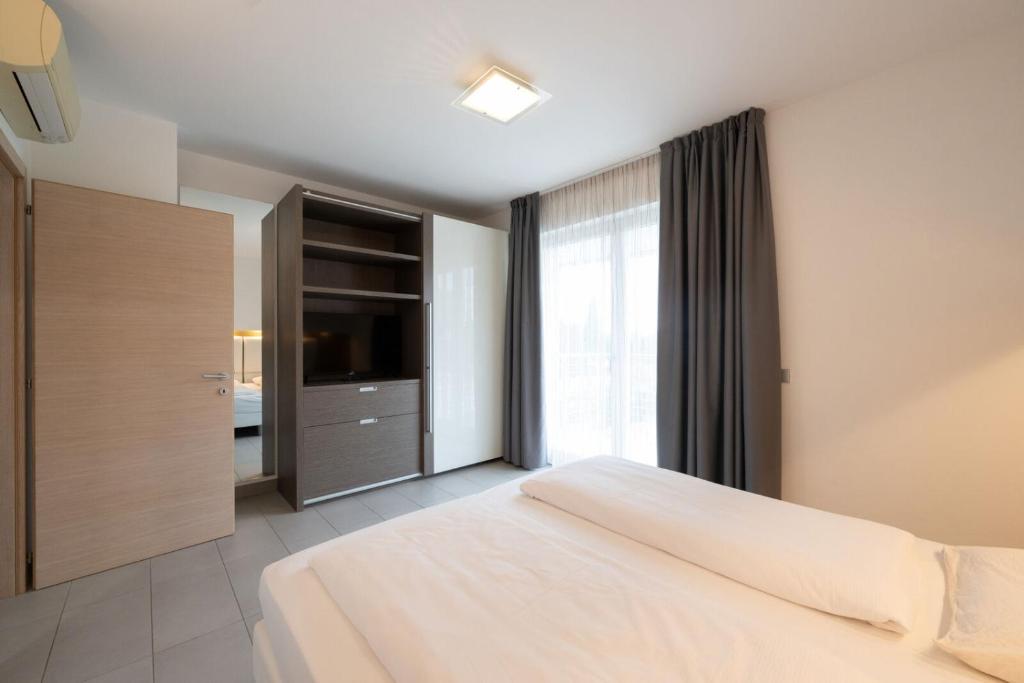Een bed of bedden in een kamer bij Residence Desiree