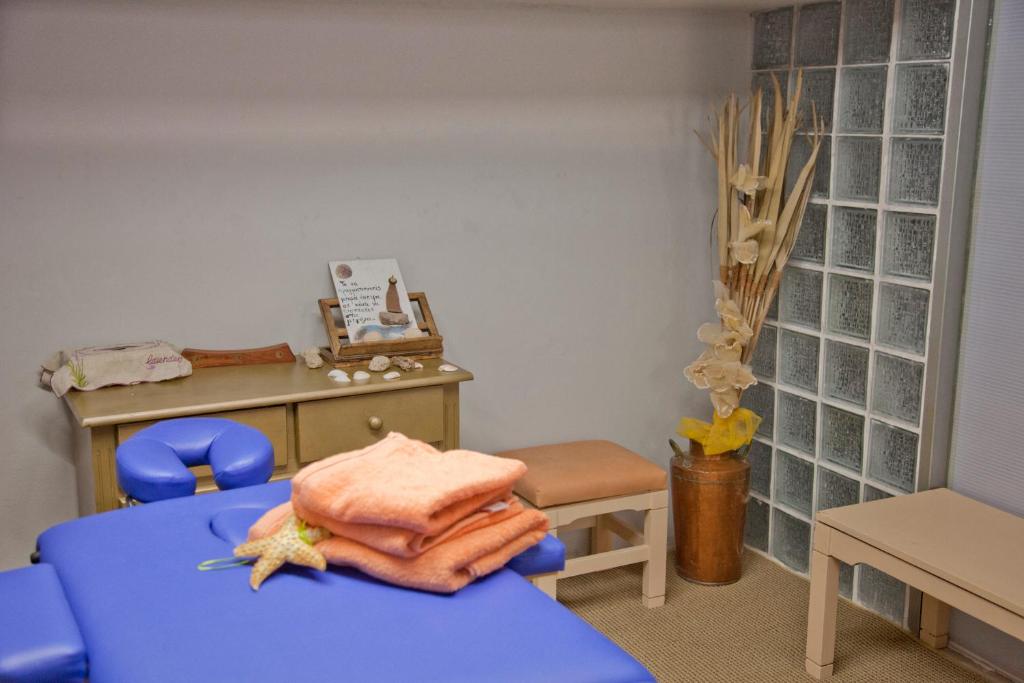 a toy room with a blue bed and a desk at Thalia deco City & Beach Hotel in Hersonissos