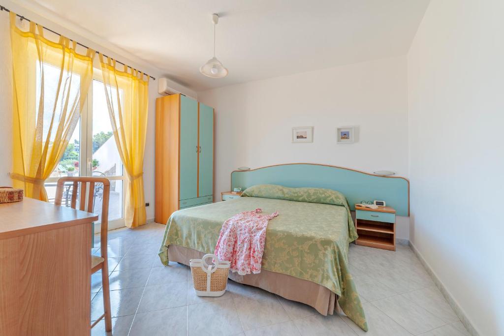 Postel nebo postele na pokoji v ubytování Poggio Del Sole