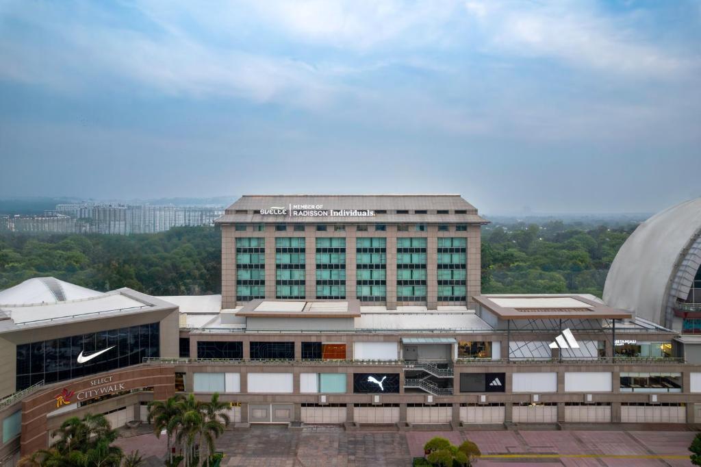 a large building with a lot of windows at Svelte Delhi, a member of Radisson Individuals in New Delhi