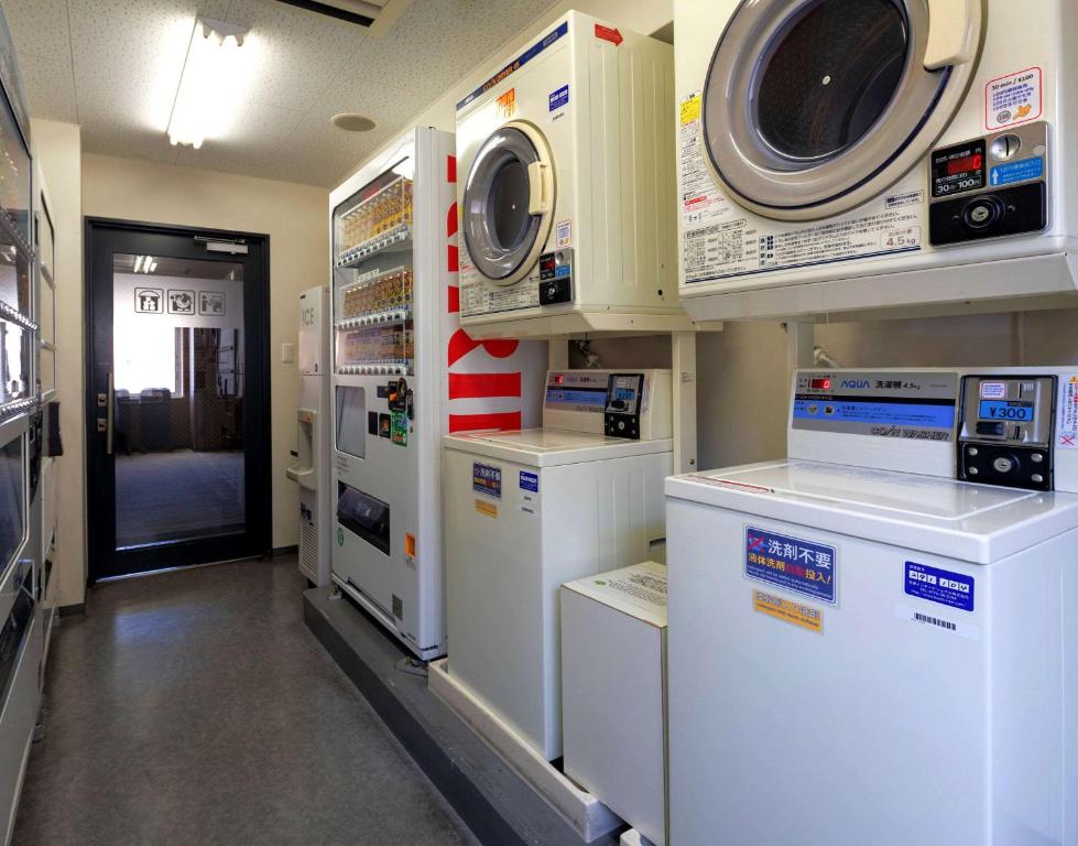 a hospital room with machines and a washer and dryer at Comfort Hotel Nara in Nara