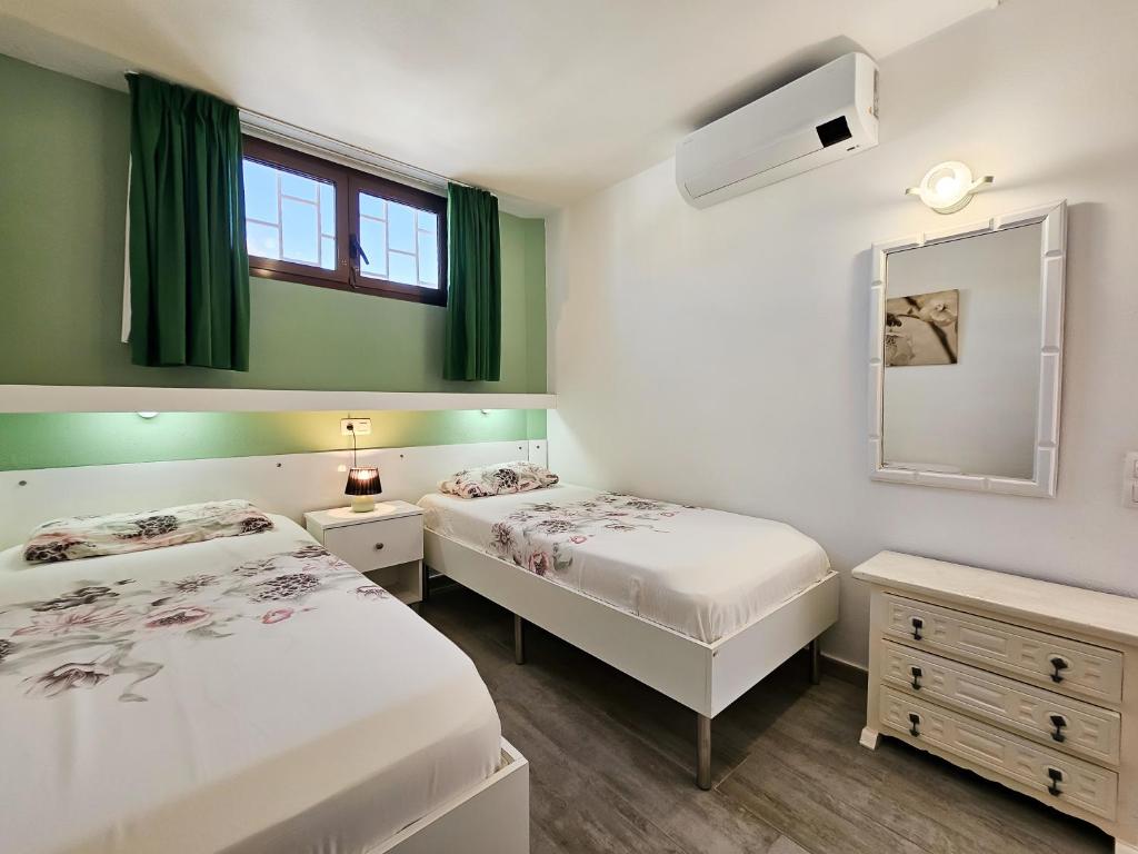 Postel nebo postele na pokoji v ubytování Apartamentos Bogota