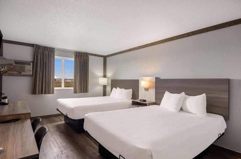 Postel nebo postele na pokoji v ubytování Econo Lodge Scottsbluff