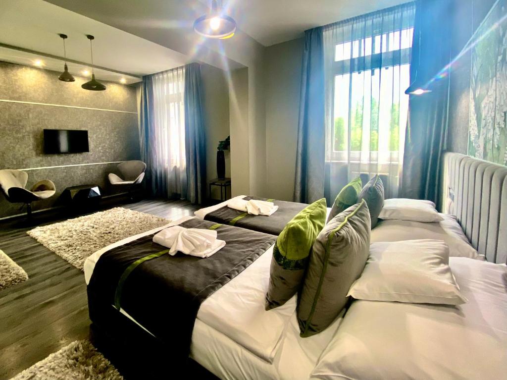 Posteľ alebo postele v izbe v ubytovaní Hotel Central