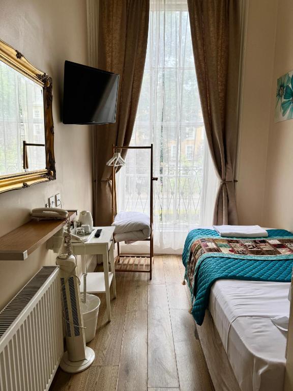 Postel nebo postele na pokoji v ubytování ABC Hyde Park Hotel
