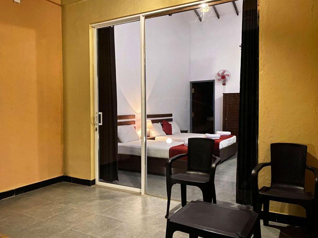 Postel nebo postele na pokoji v ubytování Athyantha Resort