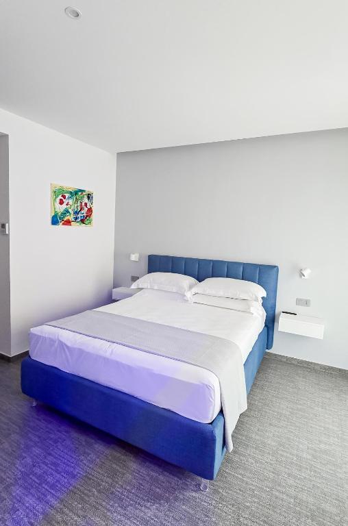 Postel nebo postele na pokoji v ubytování Papavero Giallo B&B