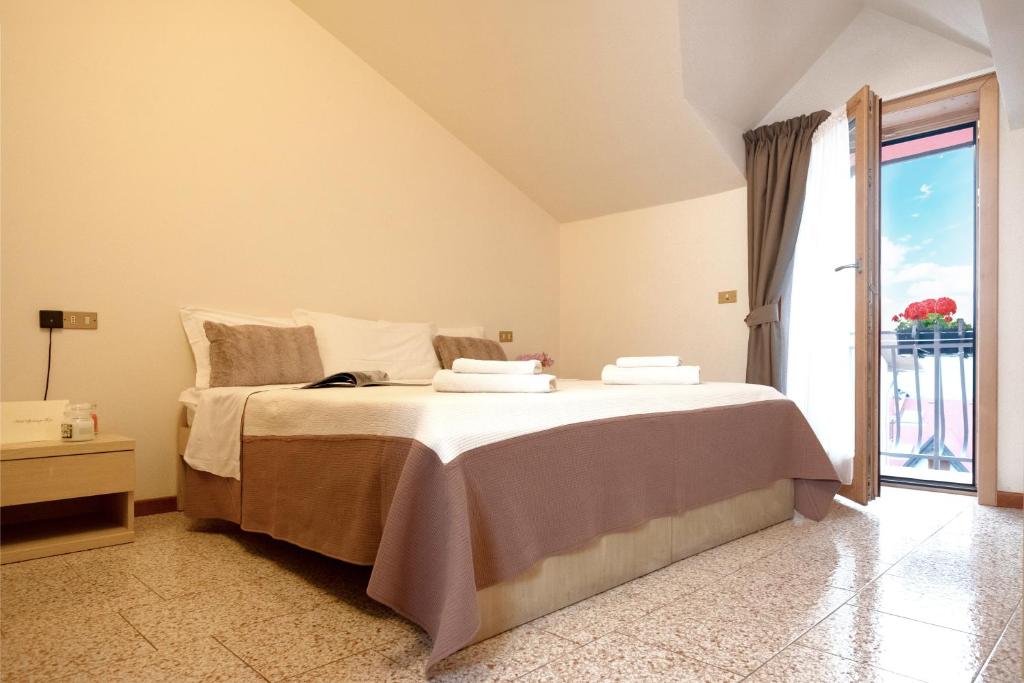 Postel nebo postele na pokoji v ubytování Albergo Trattoria Speranza