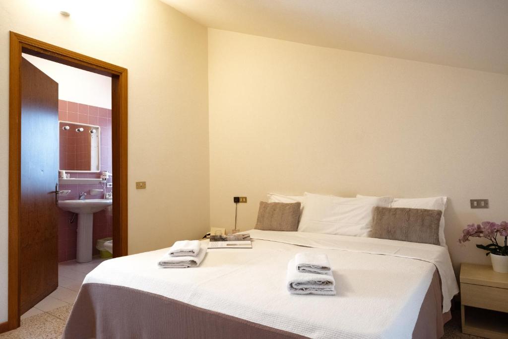 Postel nebo postele na pokoji v ubytování Albergo Trattoria Speranza