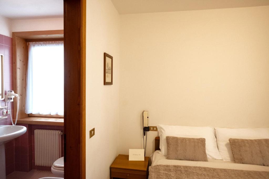 Postel nebo postele na pokoji v ubytování Albergo Trattoria Speranza