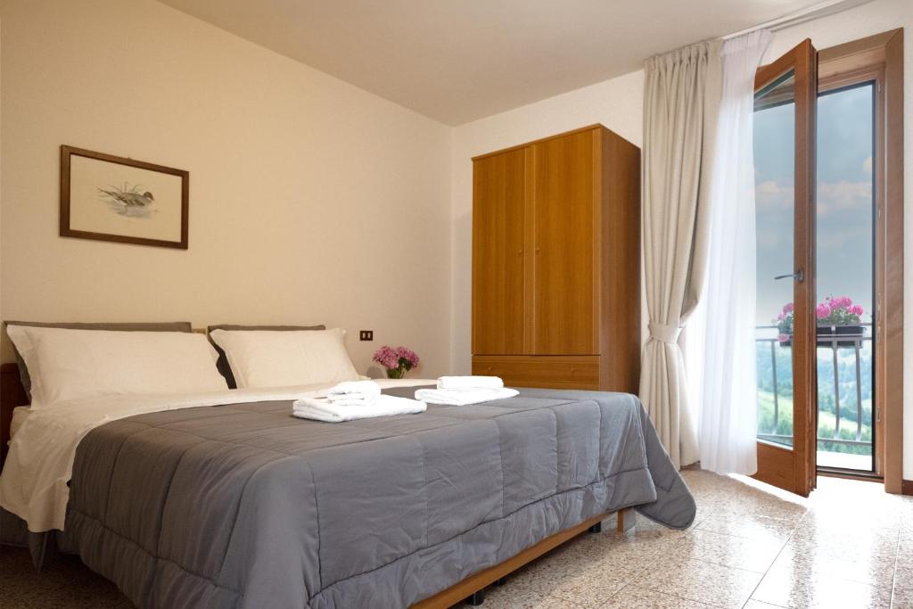 Postel nebo postele na pokoji v ubytování Albergo Trattoria Speranza