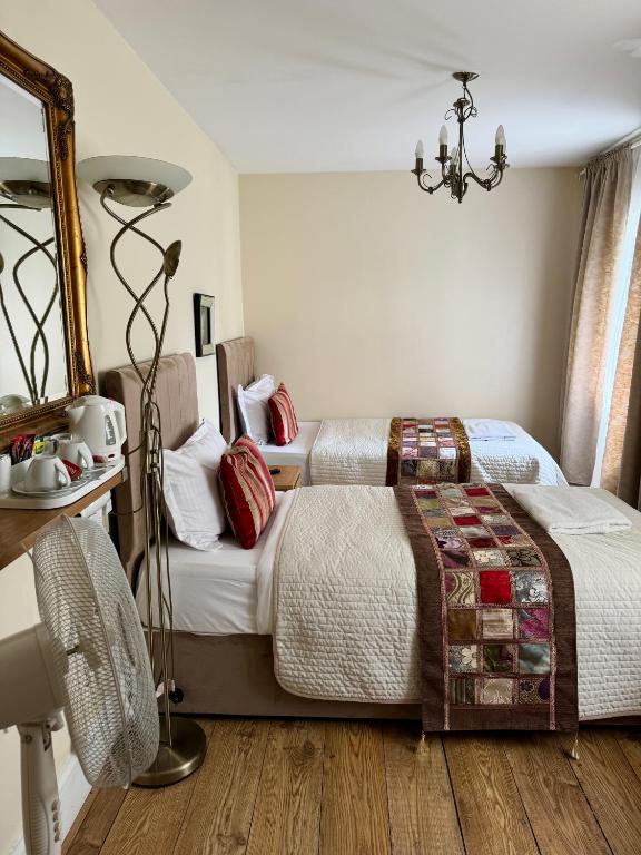 Postel nebo postele na pokoji v ubytování ABC Hyde Park Hotel