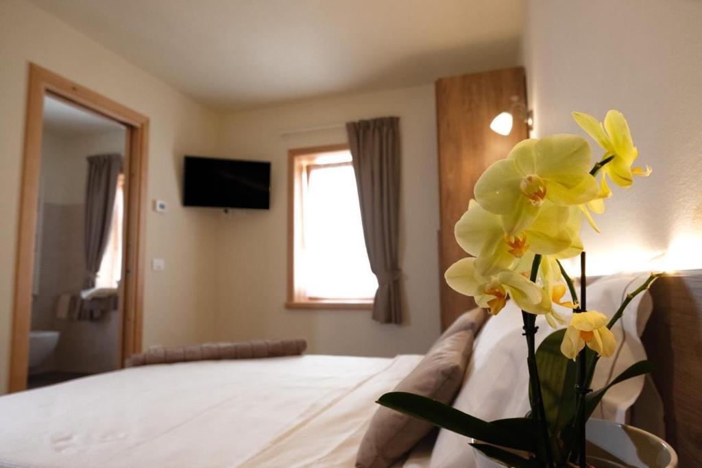 Postel nebo postele na pokoji v ubytování Albergo Trattoria Speranza
