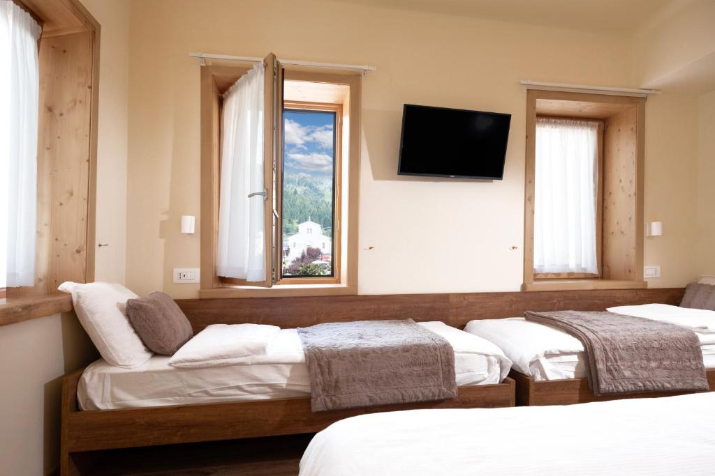 Postel nebo postele na pokoji v ubytování Albergo Trattoria Speranza