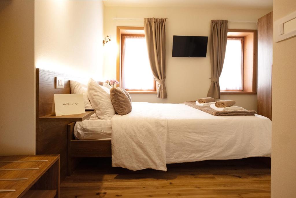 Postel nebo postele na pokoji v ubytování Albergo Trattoria Speranza